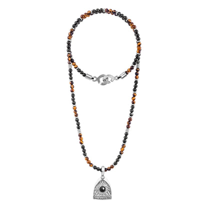 Collar de 39cm con piedras de 4mm, mini donas en acero, dije de ojo terminado en acero anticado - Joyería y bisutería fina