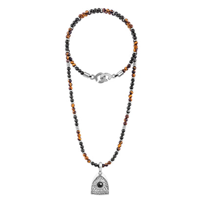 Collar de 39cm con piedras de 4mm, mini donas en acero, dije de ojo terminado en acero anticado - Joyería y bisutería fina