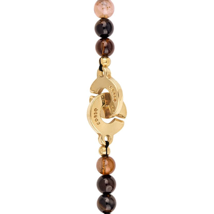 Collar de 26cm con dije con flor de Corso, hojuelas y broche en baño de oro 22K - Joyería y bisutería fina