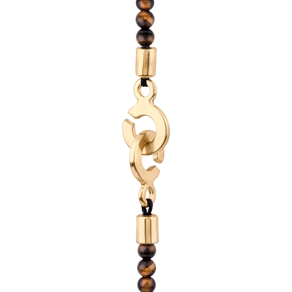 Collar de 39cm con piedras de 4mm, mini donas en acero, dije de ojo terminado en acero anticado bañado en oro 22K - Joyería y bisutería fina