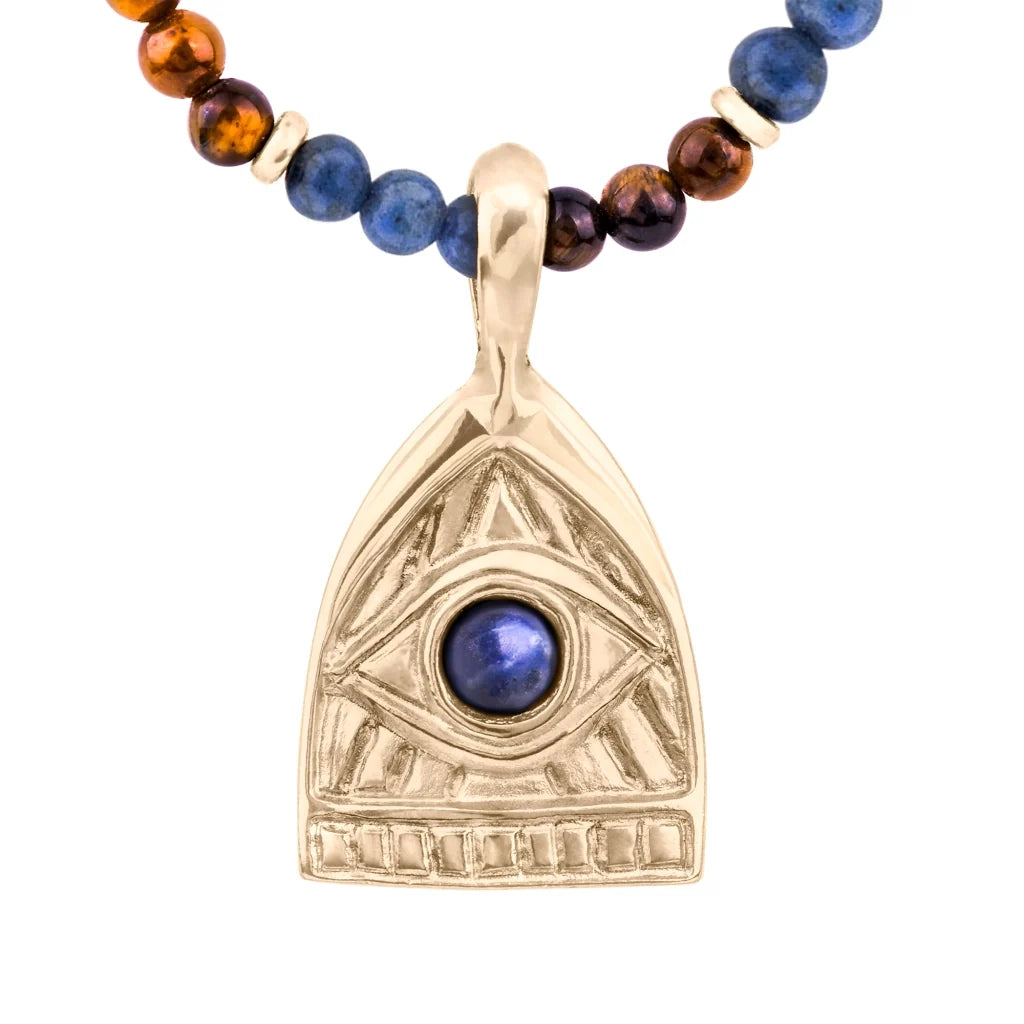 Collar de 39cm con piedras de 4mm, mini donas en acero, dije de ojo terminado en acero anticado bañado en oro 22K - Joyería y bisutería fina