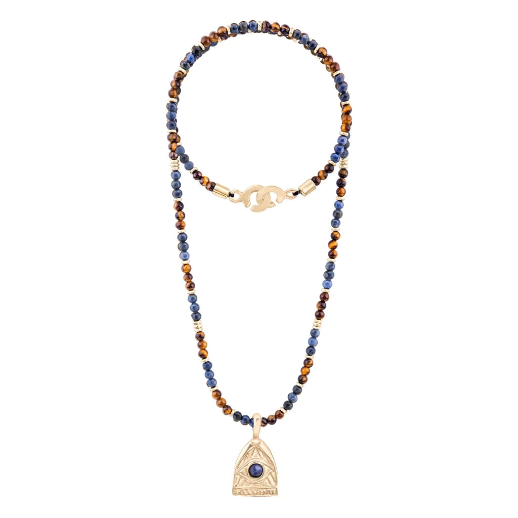 Collar de 39cm con piedras de 4mm, mini donas en acero, dije de ojo terminado en acero anticado bañado en oro 22K - Joyería y bisutería fina