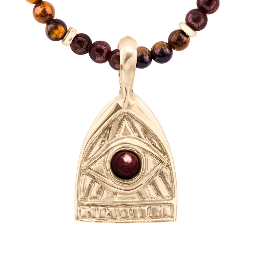 Collar de 39cm con piedras de 4mm, mini donas en acero, dije de ojo terminado en acero anticado bañado en oro 22K - Joyería y bisutería fina