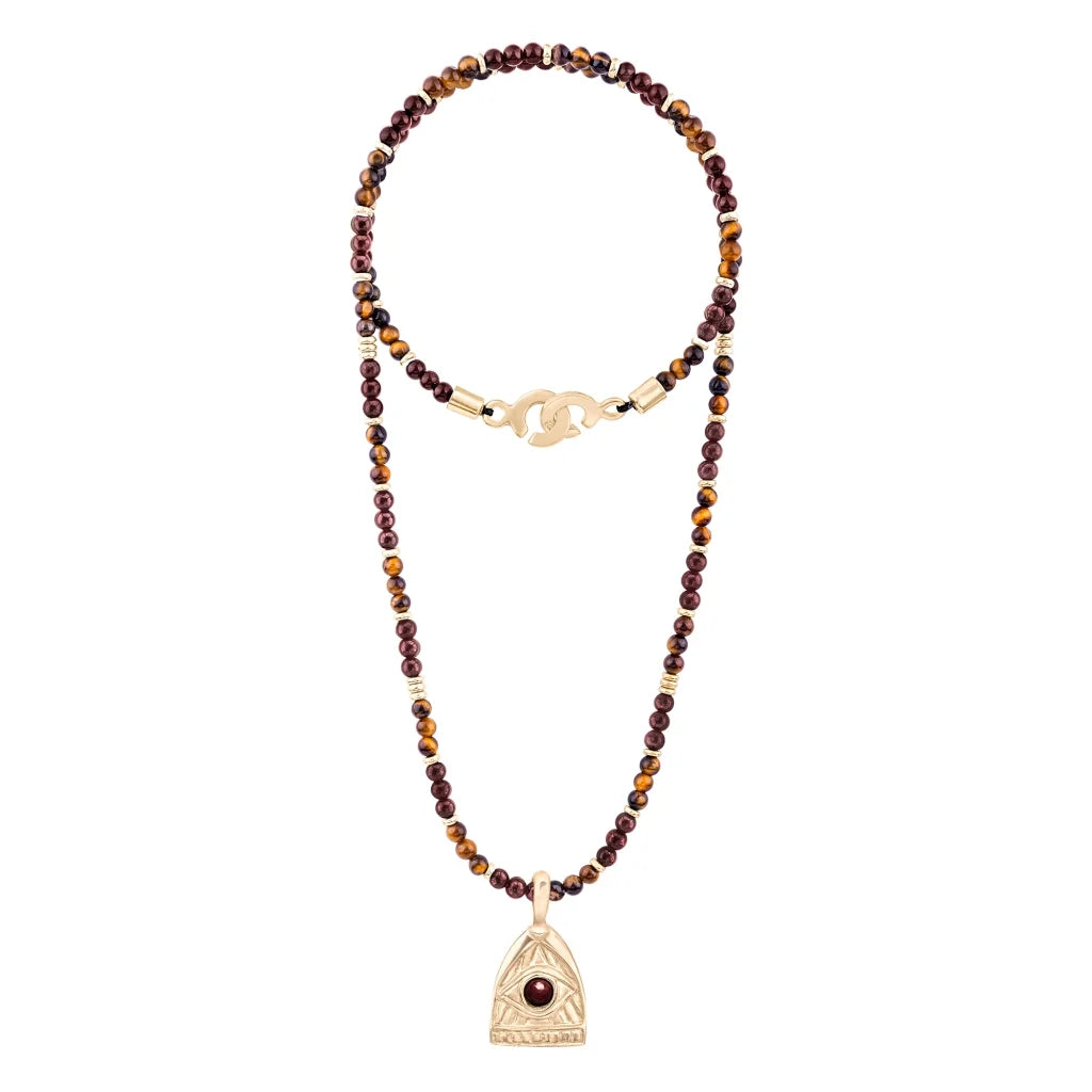 Collar de 39cm con piedras de 4mm, mini donas en acero, dije de ojo terminado en acero anticado bañado en oro 22K - Joyería y bisutería fina