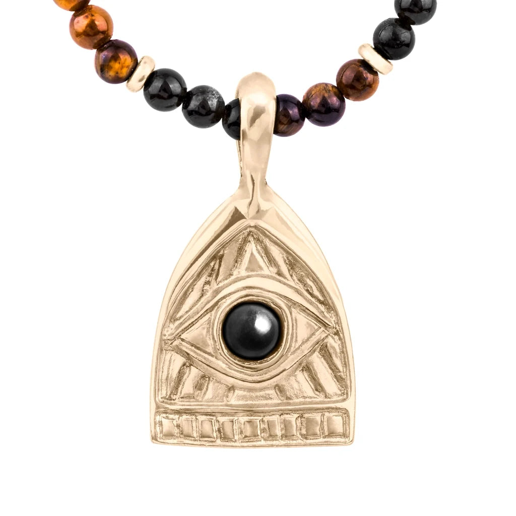 Collar de 39cm con piedras de 4mm, mini donas en acero, dije de ojo terminado en acero anticado bañado en oro 22K - Joyería y bisutería fina