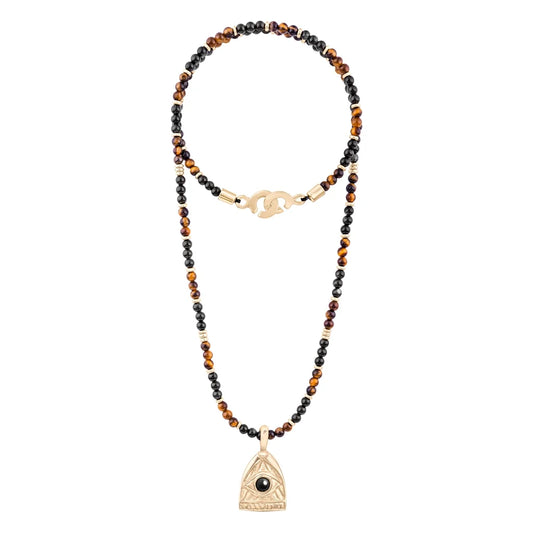 Collar de 39cm con piedras de 4mm, mini donas en acero, dije de ojo terminado en acero anticado bañado en oro 22K - Joyería y bisutería fina