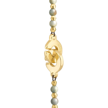 Collar de 78.5cm con piedras de calcita agua de 8mm y 6mm, con componentes en baño de oro 22K con un dije de cuarzo pulido - Joyería y bisutería fina