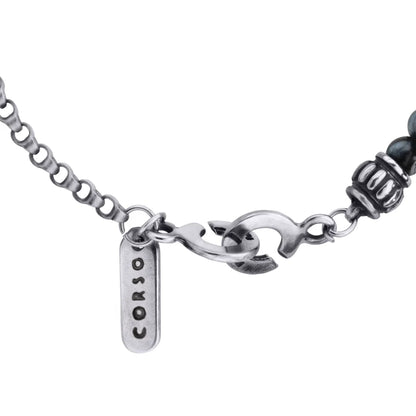Collar de 35.5cm con piedras de 6mm,cadena de acero anticado y dije de cruz africana barroca en terminado de acero pulido - Joyería y bisutería fina