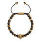 Pulsera ajustable con hilo de seda, piedras 6mm, placa insignia, semillas y calavera en baño de oro de 22K - Joyería y bisutería fina