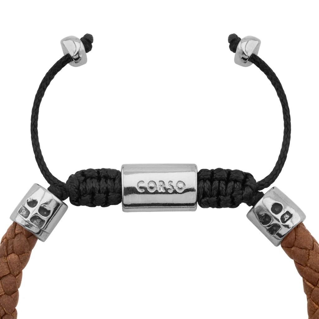 Pulsera de piel natural de borrego trenzada, con detalles en terminado de acero, con placa insignia en baño de rodio - Joyería y bisutería fina