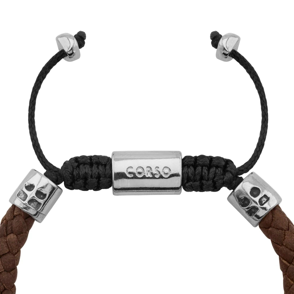 Pulsera de piel natural de borrego trenzada, con detalles en terminado de acero, con placa insignia en baño de rodio - Joyería y bisutería fina