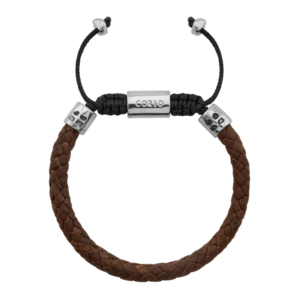 Pulsera de piel natural de borrego trenzada, con detalles en terminado de acero, con placa insignia en baño de rodio - Joyería y bisutería fina