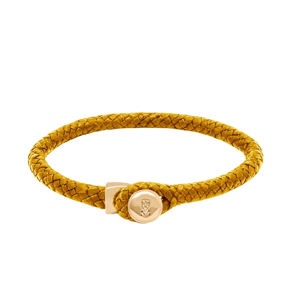Pulsera de piel natural de borrego en trenza de ocho tiras, con broche en baño de oro 22K - Joyería y bisutería fina