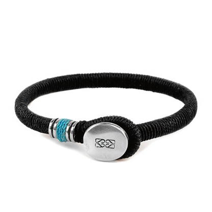 Pulsera unisex con hilo encerado, complementada con un cilindro y un broche de botón en terminado acero. Disponible en 6 colores de hilo. - Joyería y bisutería fina