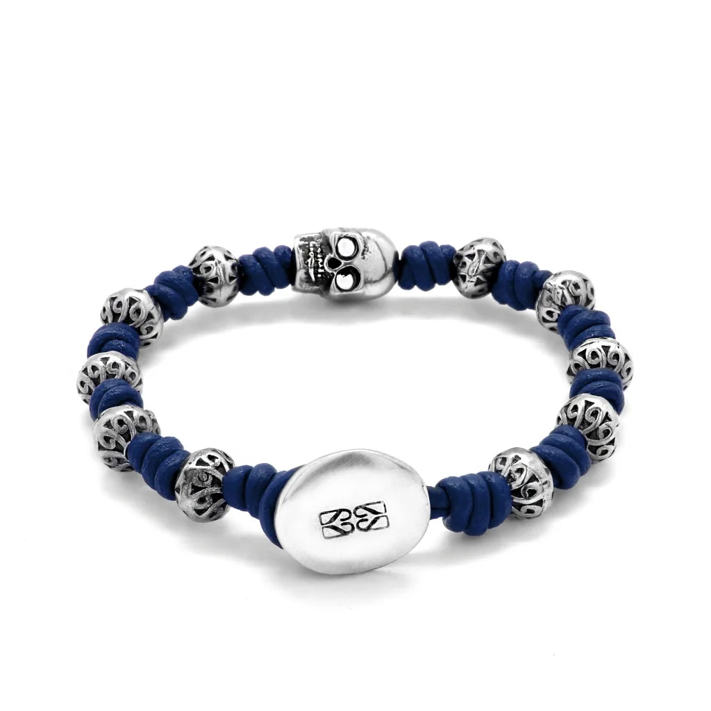 Pulsera de nudos de piel natural española, con broche de botón, mantras y calavera en terminado de acero - Joyería y bisutería fina