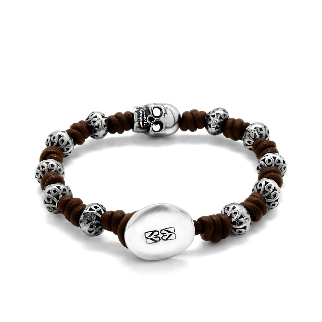 Pulsera de nudos de piel natural española, con broche de botón, mantras y calavera en terminado de acero - Joyería y bisutería fina