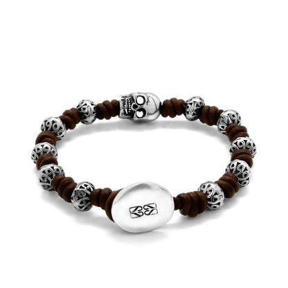 Pulsera de nudos de piel natural española, con broche de botón, mantras y calavera en terminado de acero - Joyería y bisutería fina