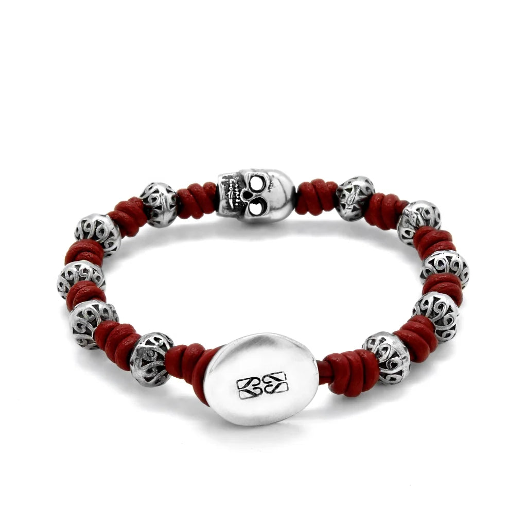 Pulsera de nudos de piel natural española, con broche de botón, mantras y calavera en terminado de acero - Joyería y bisutería fina