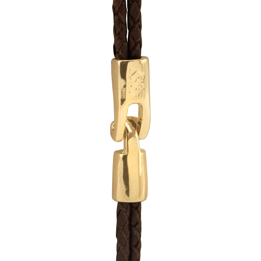 Pulsera de piel natural de borrego trenzada, con broche y detalle tubular en baño de oro de 22K - Joyería y bisutería fina