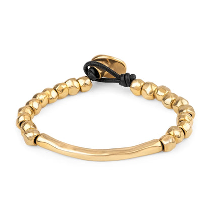 Pulsera de Piel española con cuentas geométricas, elemento tubular y broche de botón en baño de oro 22K- Joyería y bisutería fina