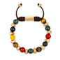 Pulsera ajustable con piedras de 8mm, con semillas y placa con insignia Corso en baño de oro de 22K - Joyería y bisutería fina