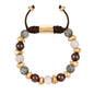 Pulsera ajustable con piedras de 8mm, con semillas y placa con insignia Corso en baño de oro de 22K - Joyería y bisutería fina