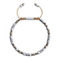 Pulsera ajustable con conchas filipinas de 3mm talladas a mano, intercaladas con cuentas bañadas en rodio - Joyería y bisutería fina